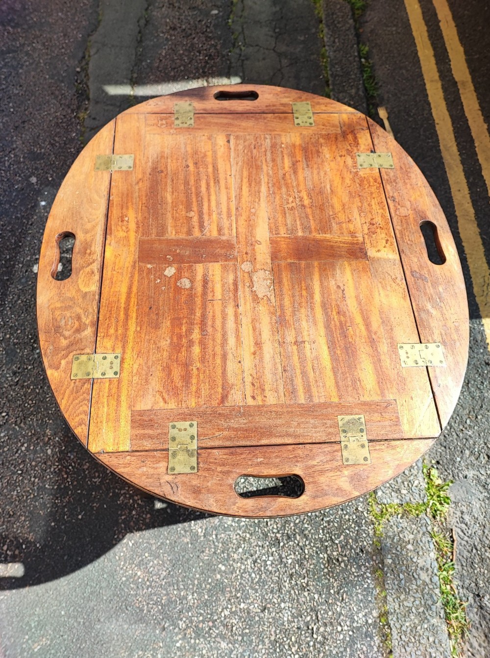 An antique mahogany campaign tray table featuring four hinged drop-down gallery sides with cutout carry handles and brass fittings, supported on a matching wooden stand. View VIII