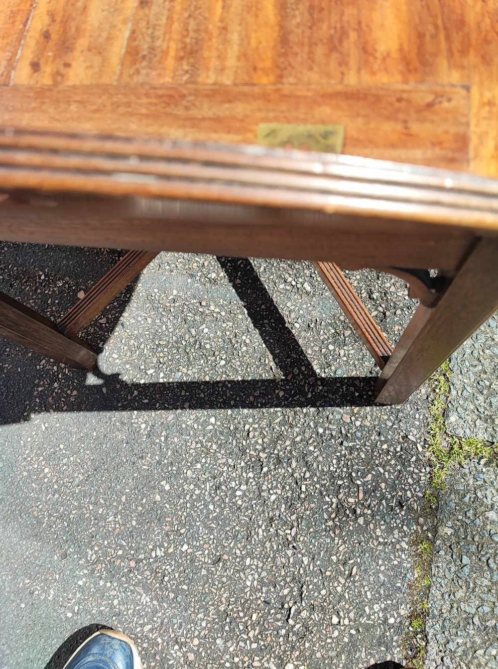 An antique mahogany campaign tray table featuring four hinged drop-down gallery sides with cutout carry handles and brass fittings, supported on a matching wooden stand. View X