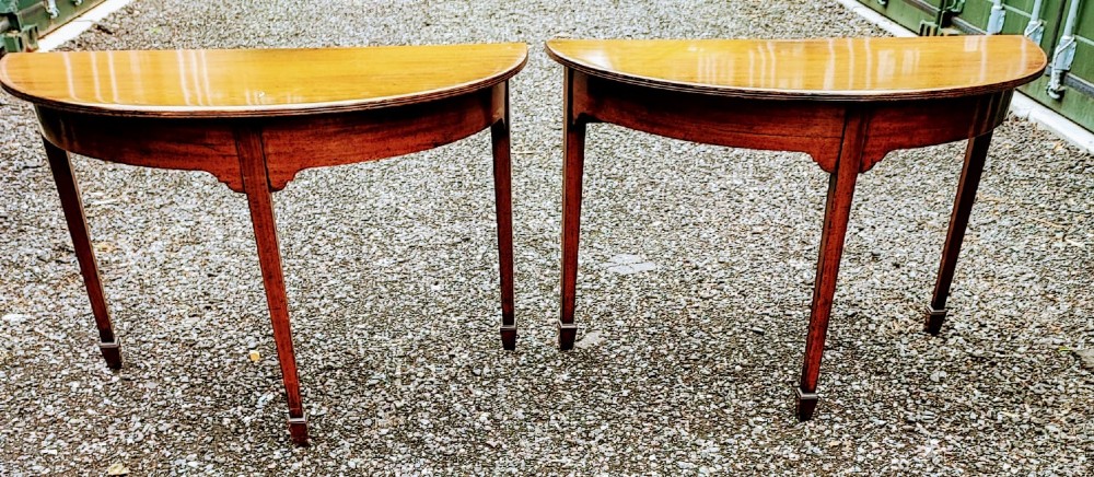 A pair of Georgian demi lune mahogany console tables View IV