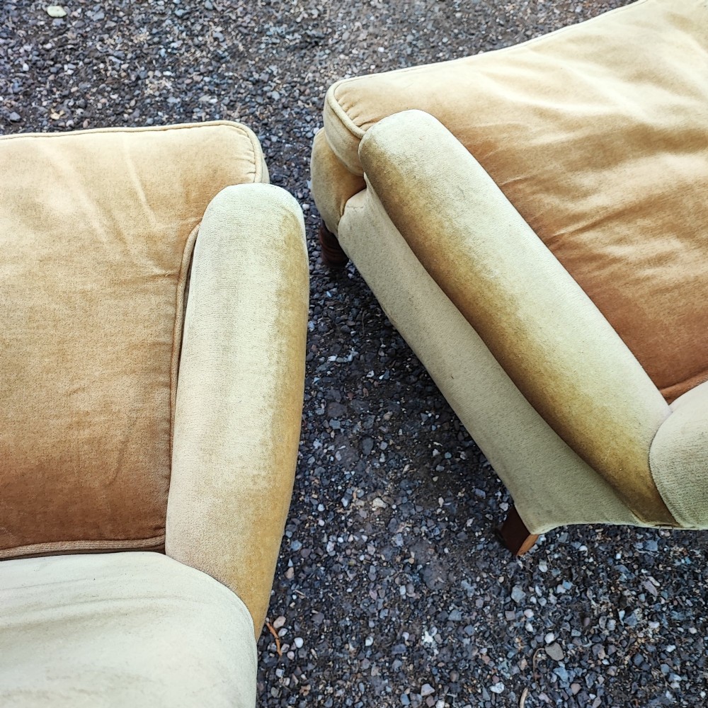A pair of Victorian armchairs upholstered in gold velvet fabric featuring high backrests and turned walnut front legs on brass castors. View III