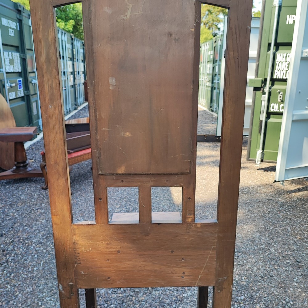 A tall Victorian oak hallstand featuring an upper mirror panel, coat hooks, a central glove drawer, and a lower stick stand with metal drip trays. View IV
