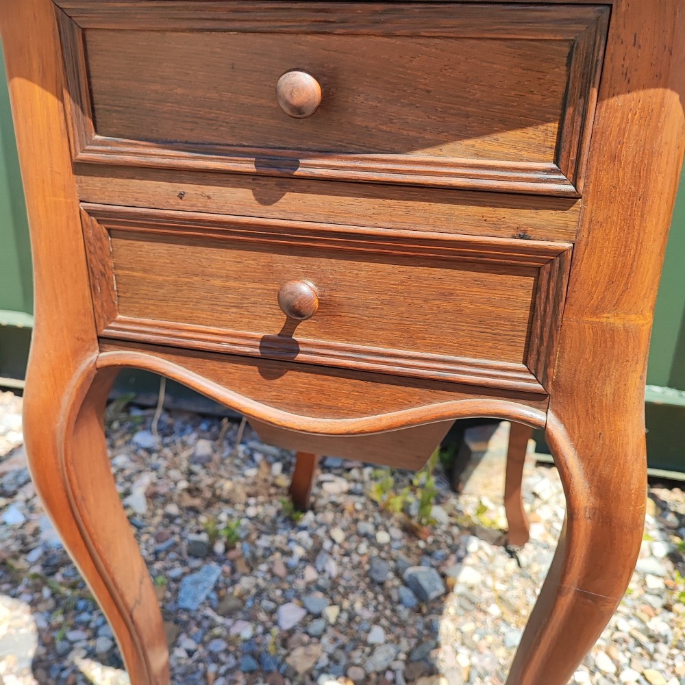 An antique rosewood drop leaf bedside table featuring cabriole legs and two front drawers with small wooden knobs. View VI