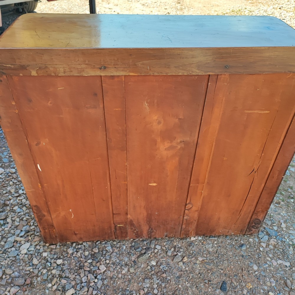A Victorian mahogany chest featuring two short drawers above two long drawers, fitted with turned wooden knobs and a low rear upstand. View III