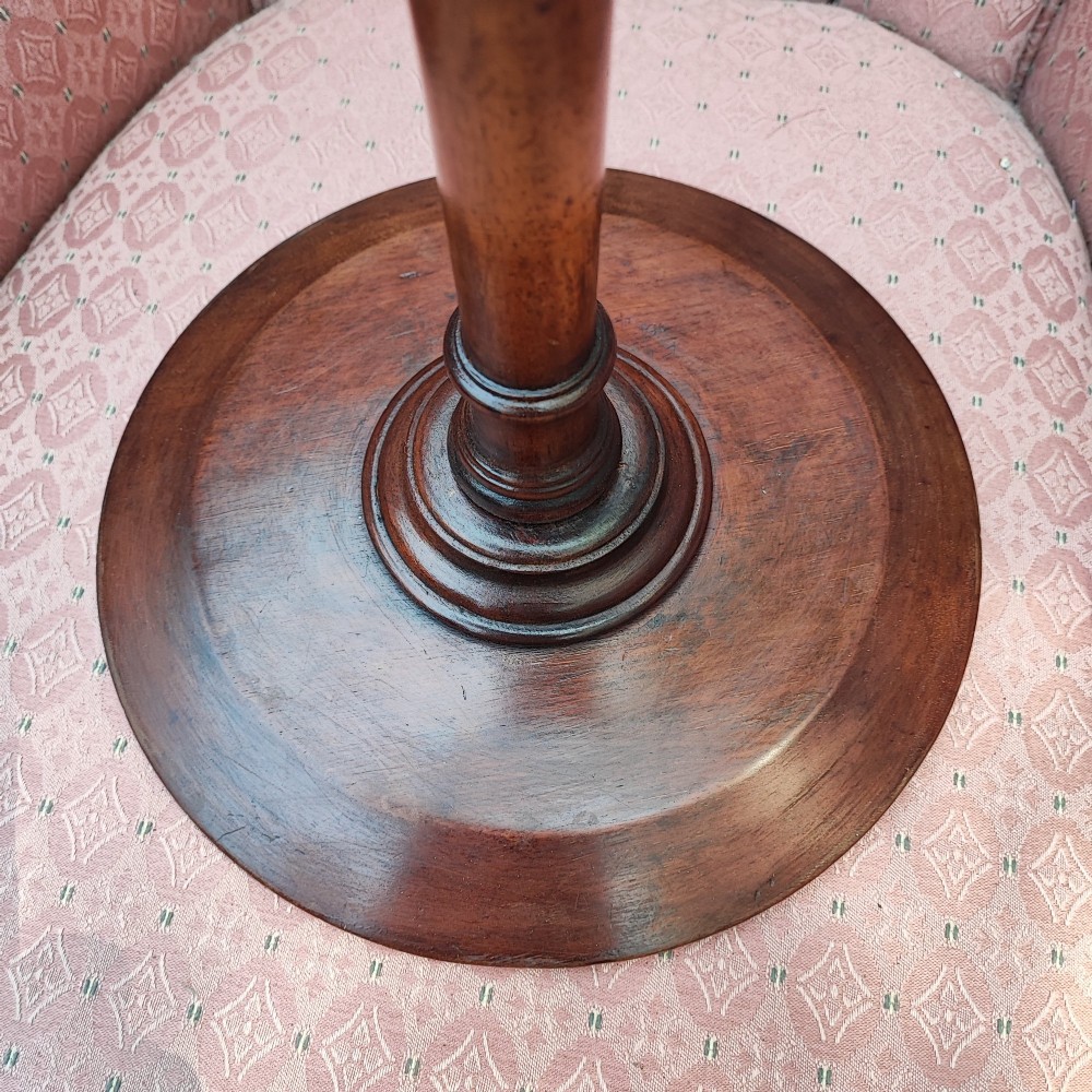 A small Edwardian mahogany wine table featuring a circular dished top supported by a turned stem and tripod legs. View II