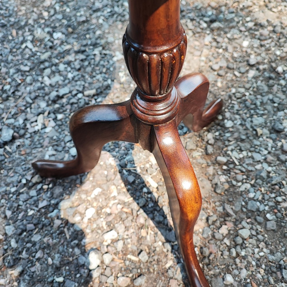 A small Edwardian mahogany wine table featuring a circular dished top supported by a turned stem and tripod legs. View IV