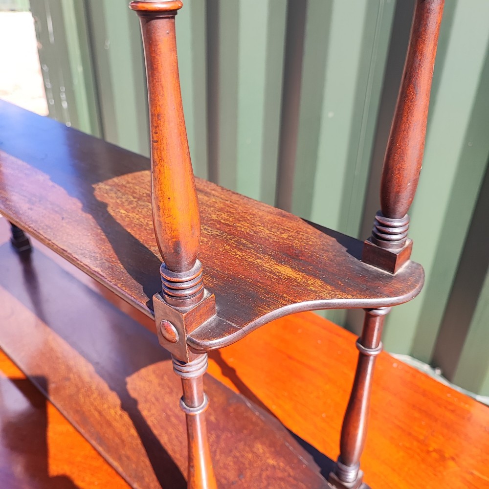 An antique Regency mahogany three-tier hanging shelf with turned spindles and finials. View III