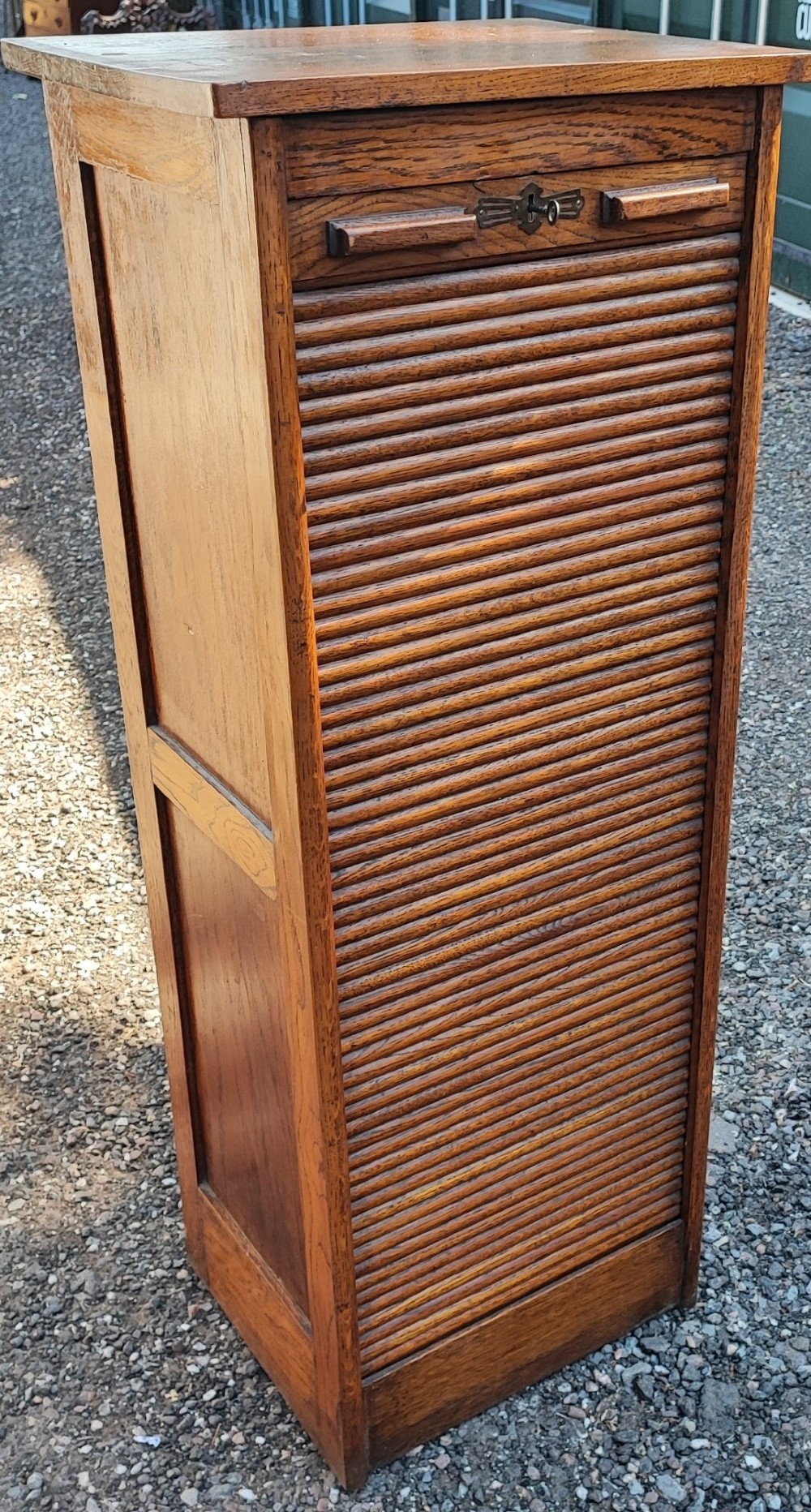 A good Edwardian oak tambour front file cabinet