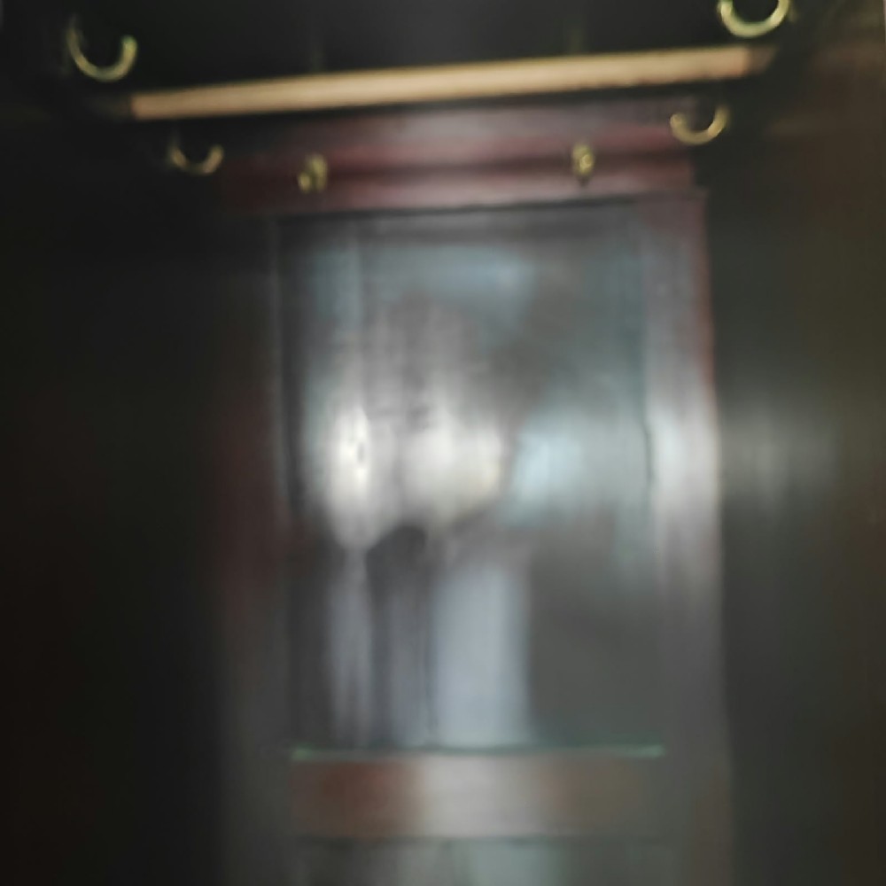 A Victorian mahogany compactum wardrobe featuring a full-length mirrored door on the left alongside a top cupboard with an oval satinwood medallion and several drawers on the right. View IV