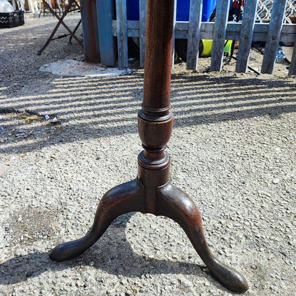 A Georgian solid oak wine table featuring a circular top, turned central pedestal, and three splayed tripod legs. View II