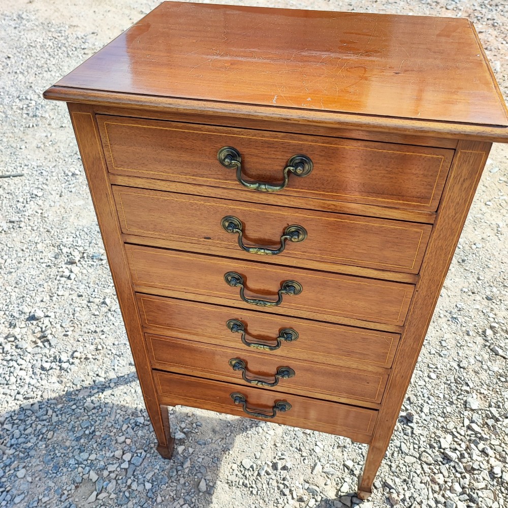 A tall Edwardian mahogany music cabinet with six drawers featuring satinwood string inlay and brass handles. View III