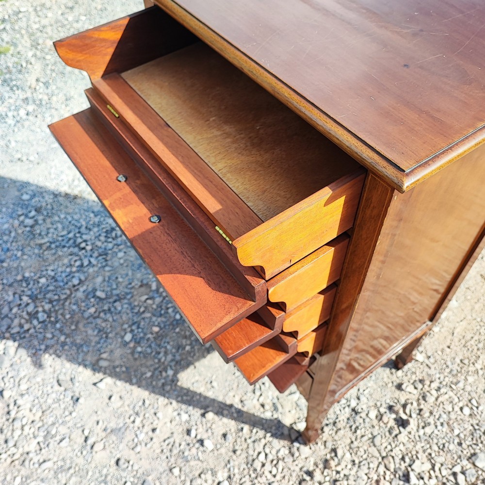 A tall Edwardian mahogany music cabinet with six drawers featuring satinwood string inlay and brass handles. View IV