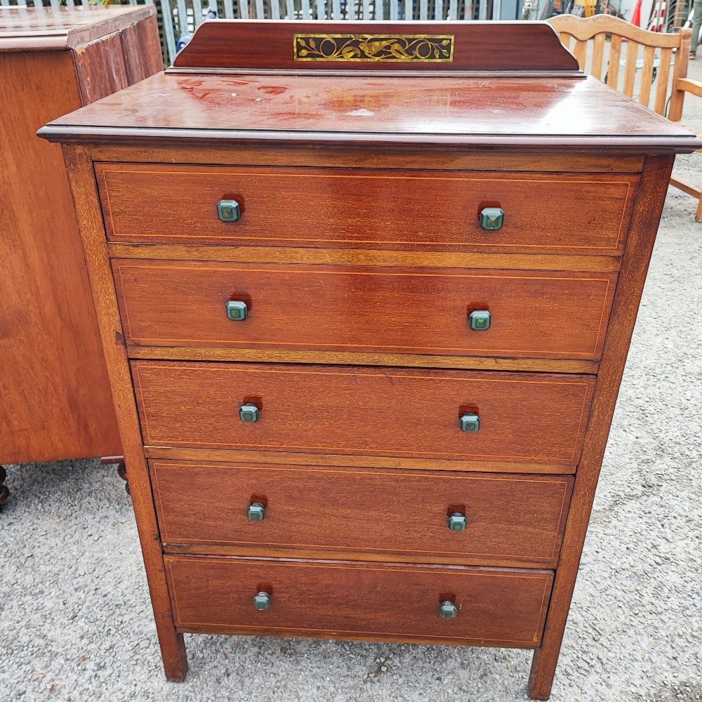 A five-drawer mahogany chest of drawers featuring boxwood line inlay, square handles, and a raised top gallery with an inlaid marquetry panel. View V