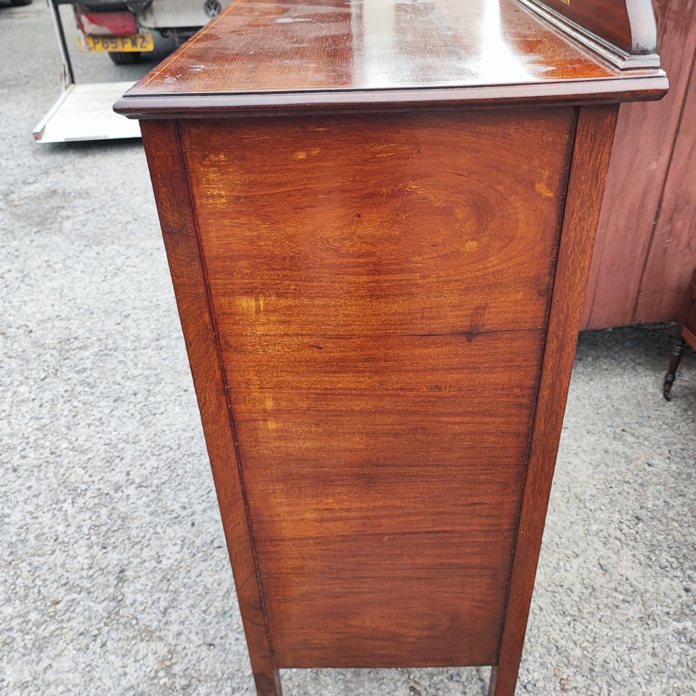 A five-drawer mahogany chest of drawers featuring boxwood line inlay, square handles, and a raised top gallery with an inlaid marquetry panel. View VII