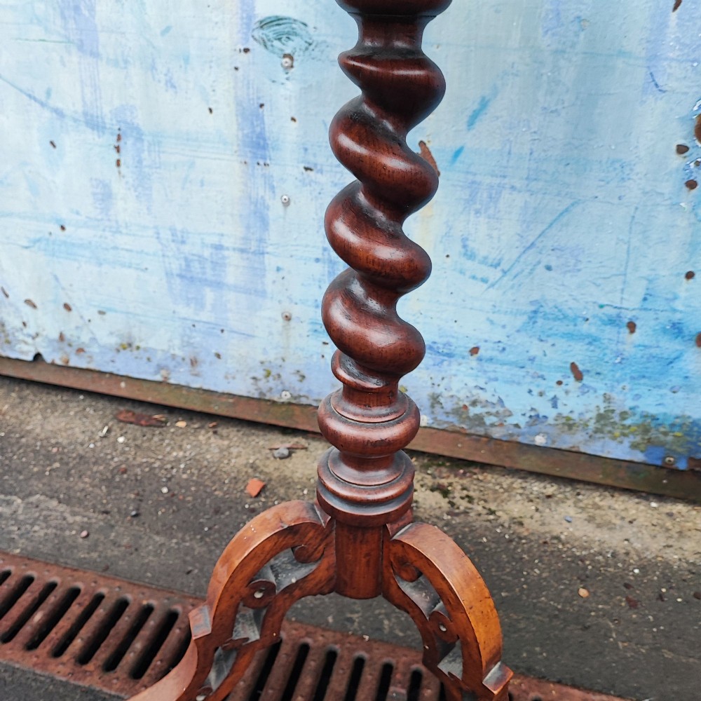 A circular rosewood and walnut wine table with elaborate floral marquetry inlay, supported by a barley twist column and a carved tripod base. View III