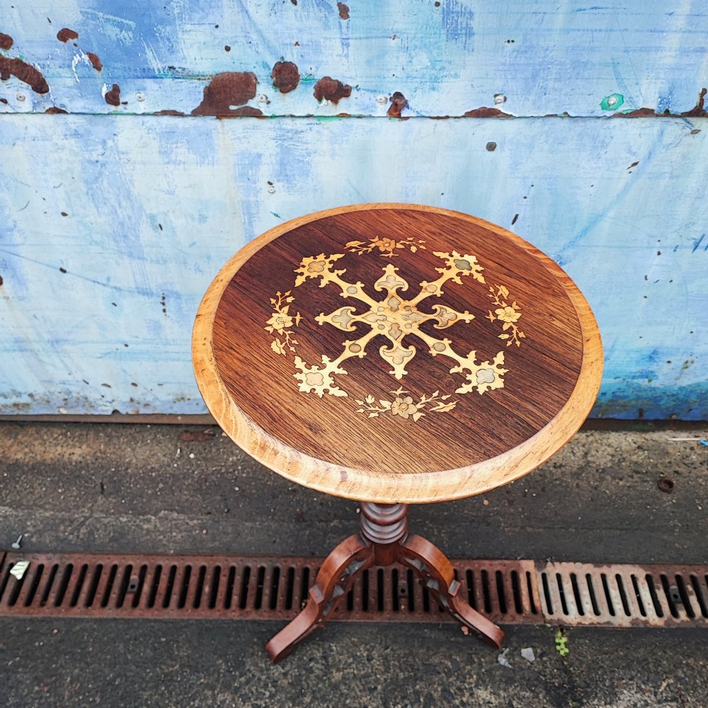 A circular rosewood and walnut wine table with elaborate floral marquetry inlay, supported by a barley twist column and a carved tripod base. View IV
