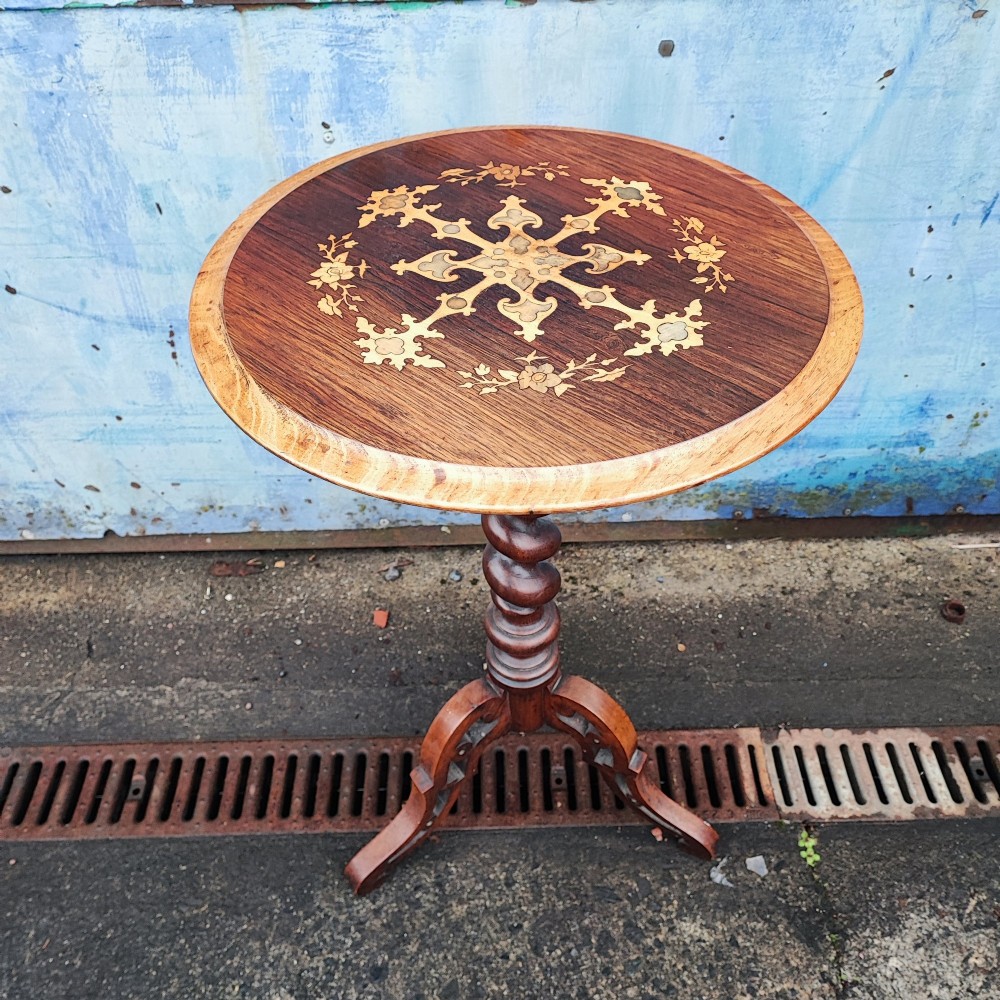 A circular rosewood and walnut wine table with elaborate floral marquetry inlay, supported by a barley twist column and a carved tripod base. View V