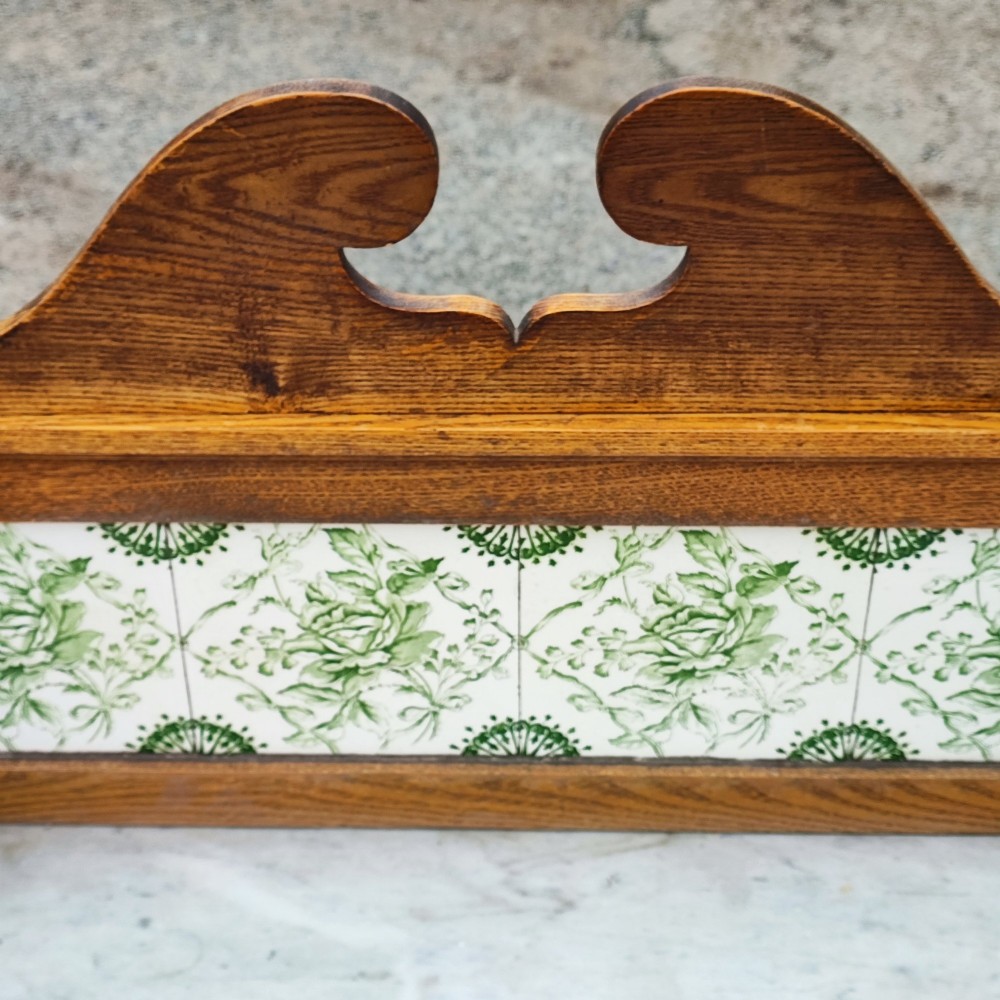 An Arts and Crafts ash timber washstand featuring a white marble top, green patterned tiled splashback, side towel rails, and turned legs. View II