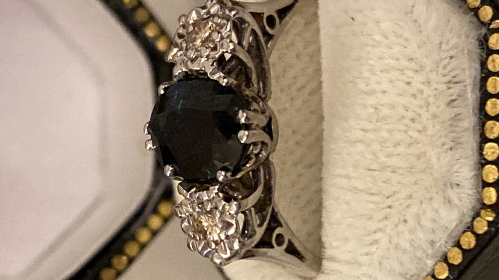 Solitary sapphire, and diamond ring