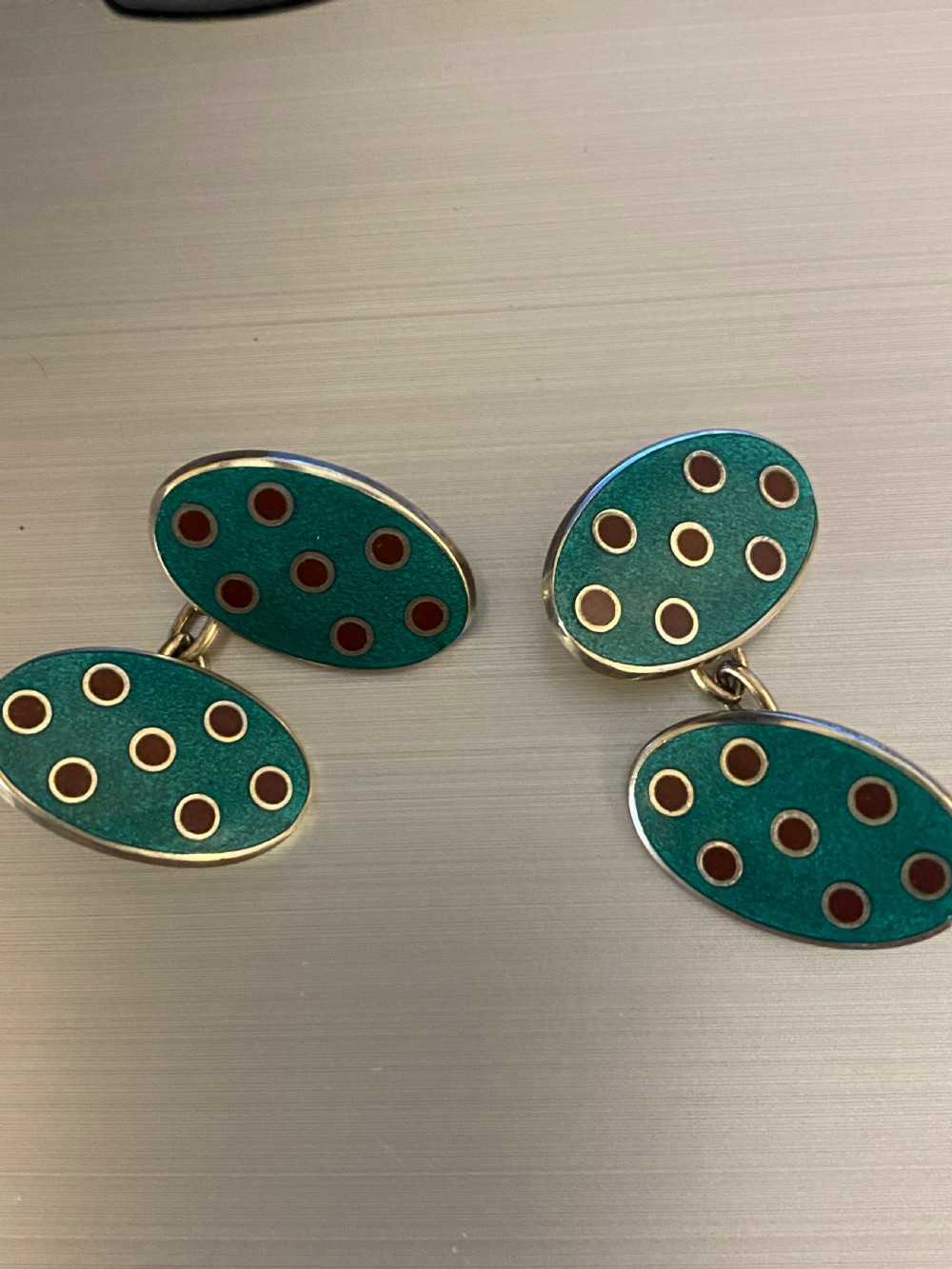 A pair of Mappin & Webb enamel cufflinks View V