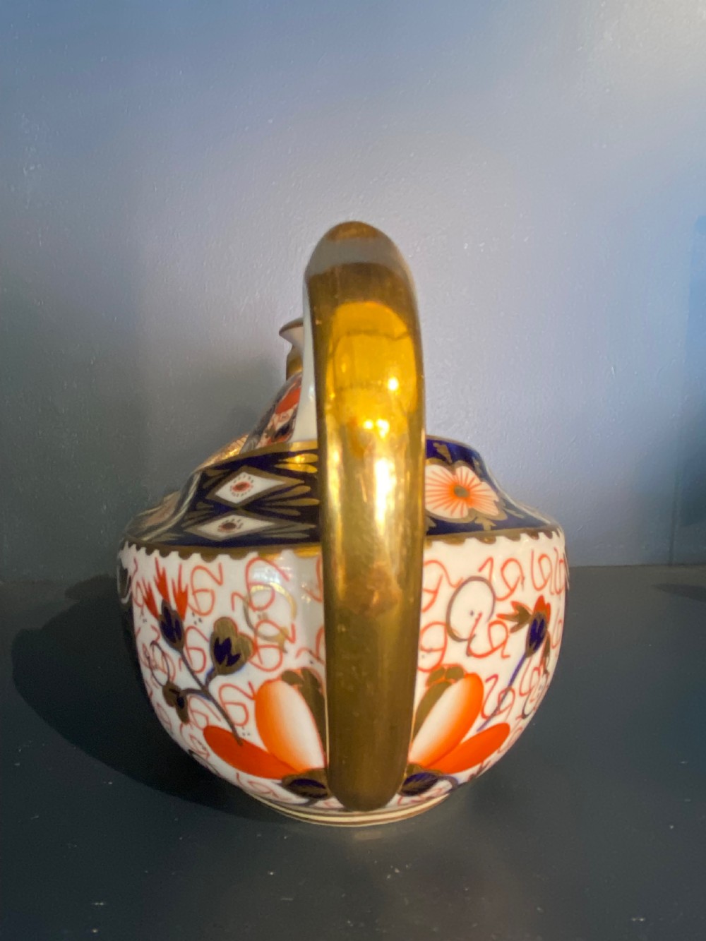 An antique Royal Crown Derby porcelain covered sugar bowl with twin handles, decorated in cobalt blue, iron red, and gilt Imari patterns. View VI