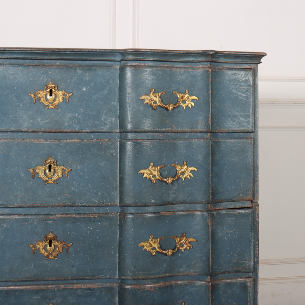An 18th-century Danish blue-painted chest of drawers featuring a shaped serpentine front, gilt brass hardware, and cabriole legs. View III