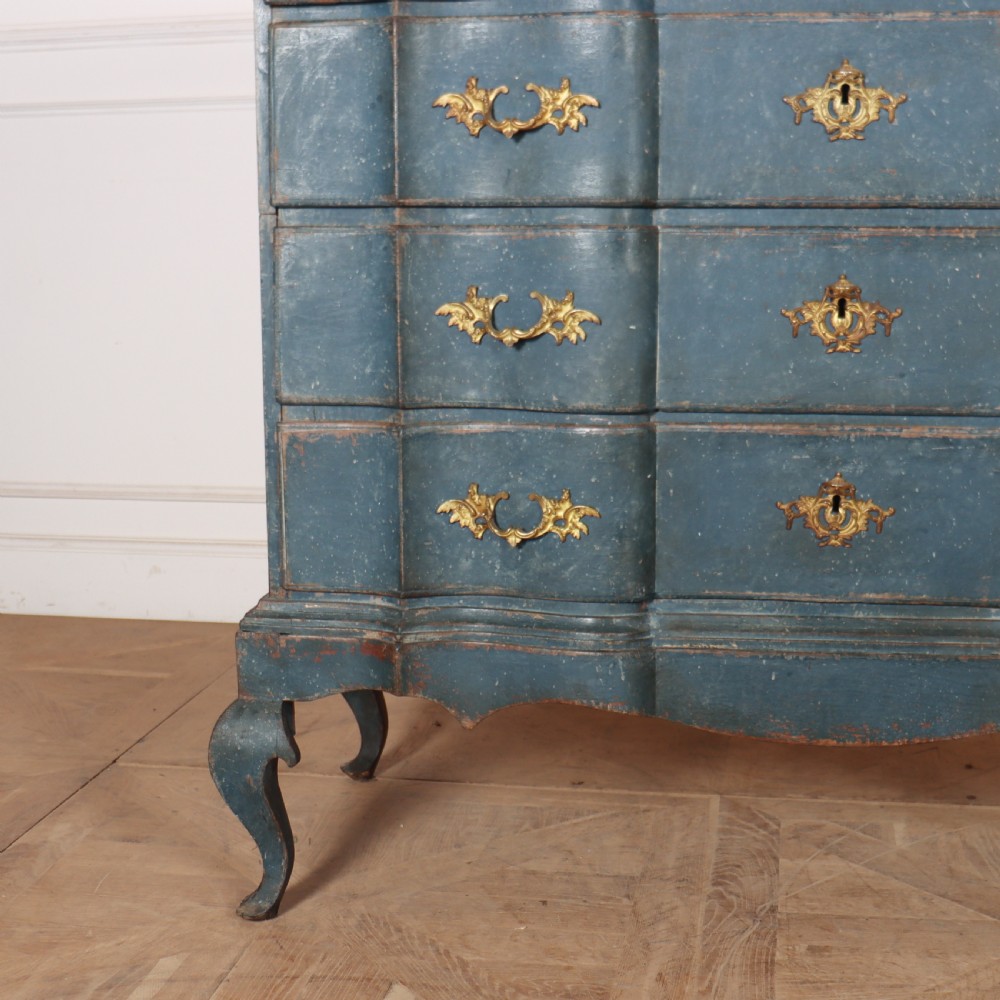 An 18th-century Danish blue-painted chest of drawers featuring a shaped serpentine front, gilt brass hardware, and cabriole legs. View VI