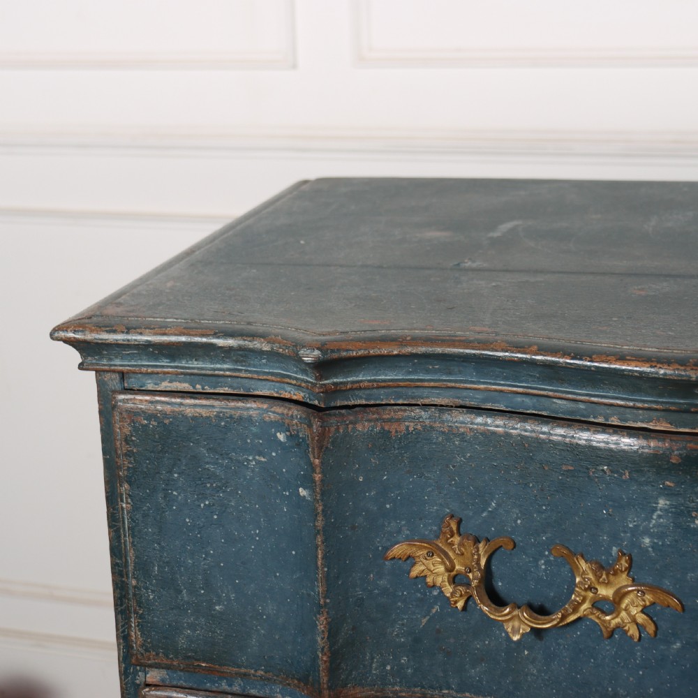 An 18th-century Danish blue-painted chest of drawers featuring a shaped serpentine front, gilt brass hardware, and cabriole legs. View VII