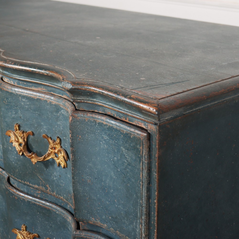 An 18th-century Danish blue-painted chest of drawers featuring a shaped serpentine front, gilt brass hardware, and cabriole legs. View VIII
