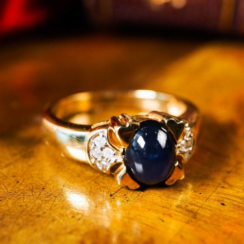 A Stylish Vintage 9k Gold Sapphire Cabochon and Diamond Ring