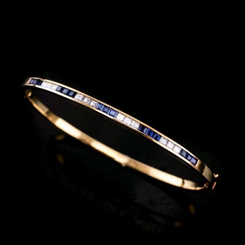 A Stylish 18k Gold Sapphire and Diamond Bangle/bracelet