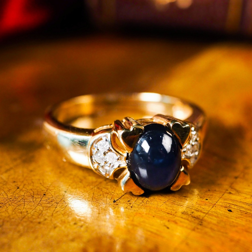 A Stylish Vintage 9K Gold Sapphire Cabochon and Diamond Ring