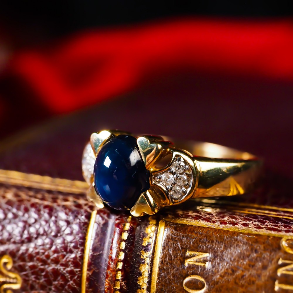 A Stylish Vintage 9K Gold Sapphire Cabochon and Diamond Ring View X