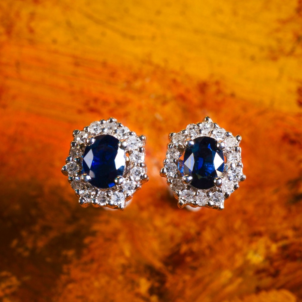 A Pair of Sapphire & Cluster Diamond Earrings 9K White Gold