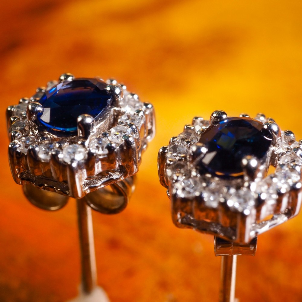 A Pair of Sapphire & Cluster Diamond Earrings 9K White Gold View II