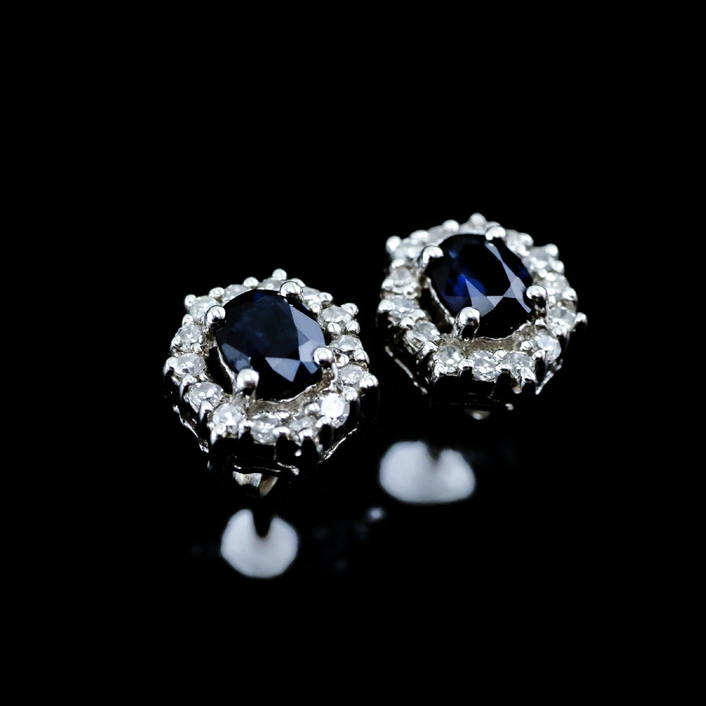 A Pair of Sapphire & Cluster Diamond Earrings 9K White Gold View V