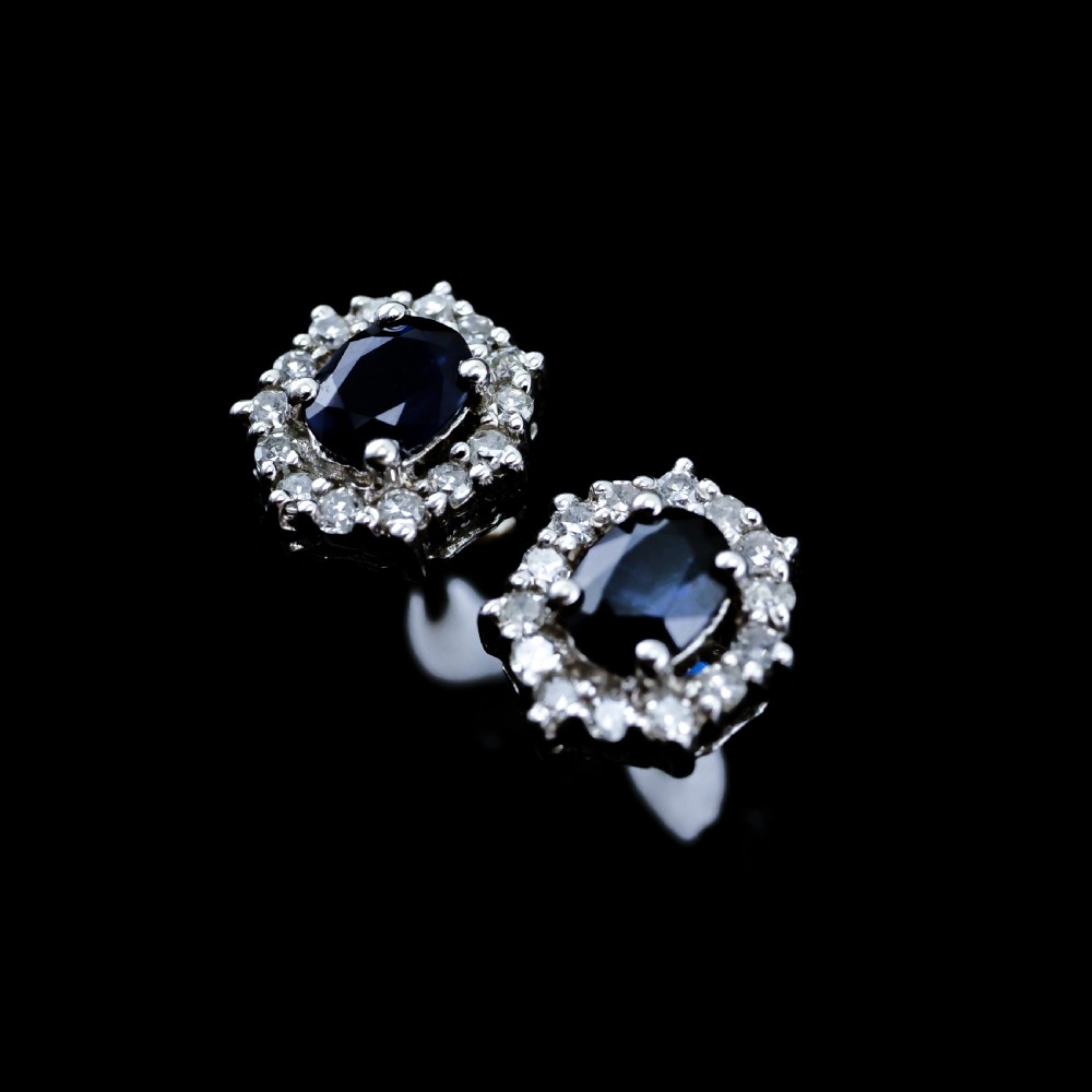 A Pair of Sapphire & Cluster Diamond Earrings 9K White Gold View VI