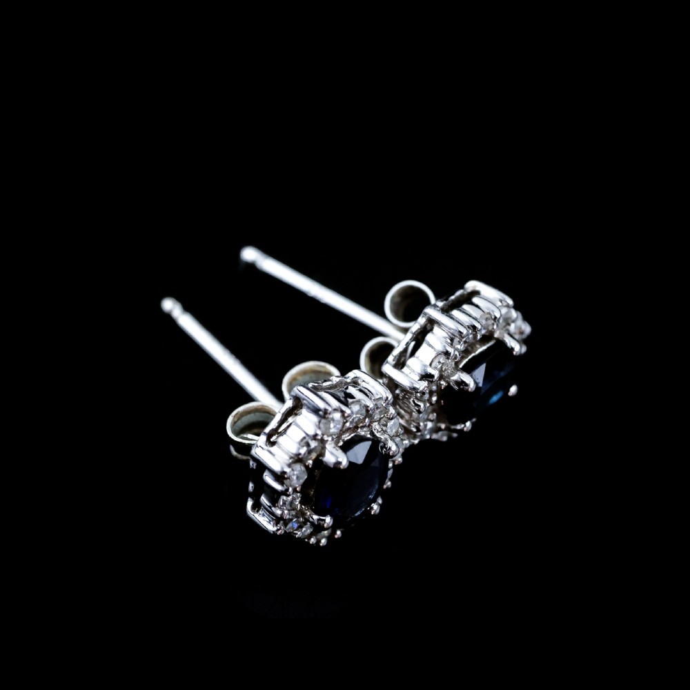 A Pair of Sapphire & Cluster Diamond Earrings 9K White Gold View VIII