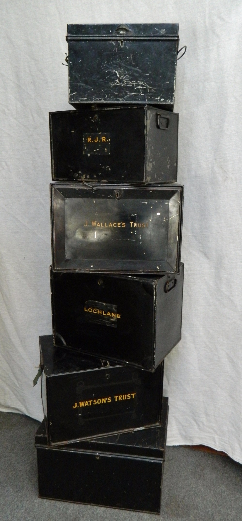 Six metal deed boxes