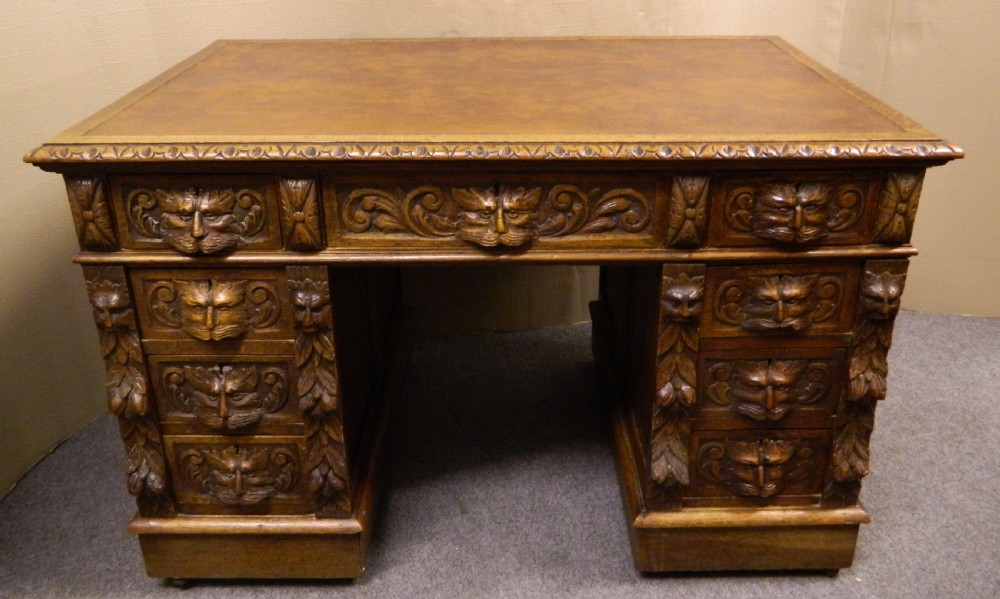 Carved oak green man desk