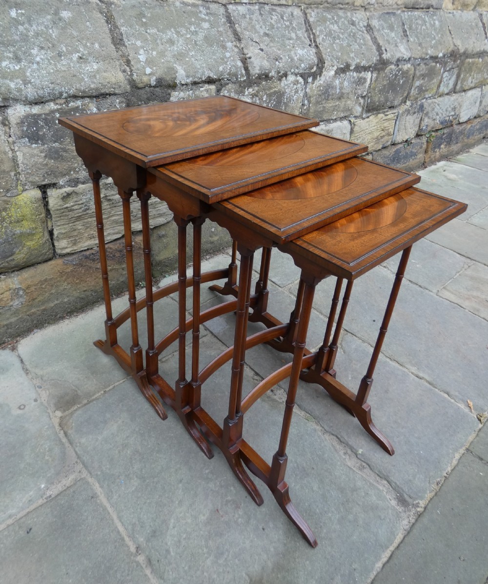 Mahogany nest of four tables