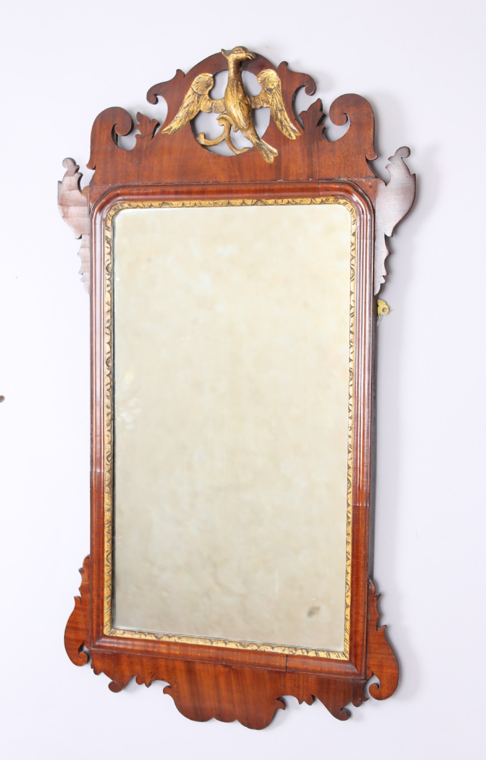 A mahogany `bird` mirror in the rococo taste