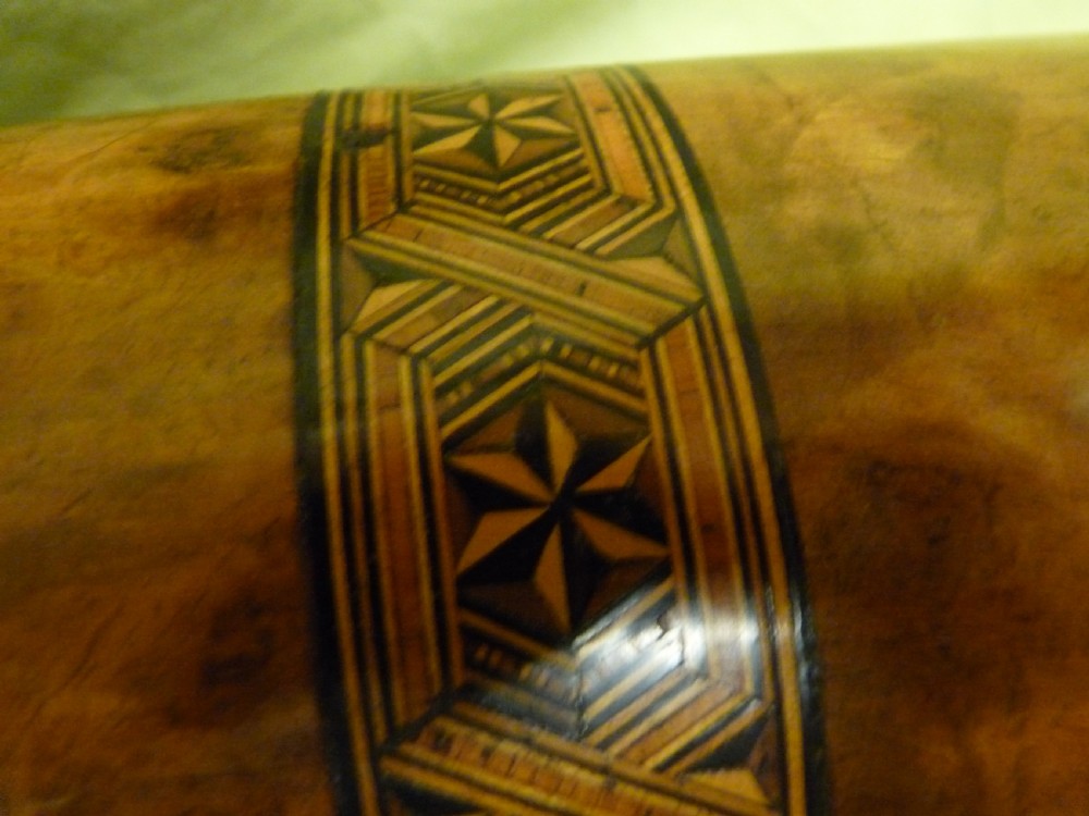 An open Victorian burr walnut tea caddy showcasing two interior lidded compartments and exterior geometric marquetry inlay. View VIII