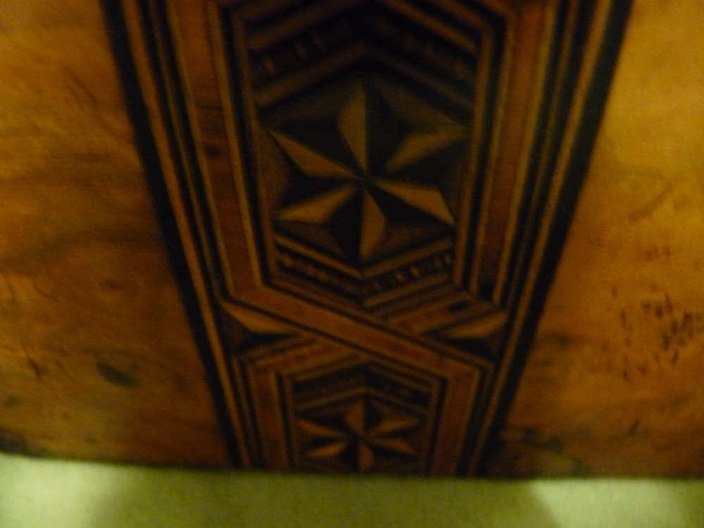 An open Victorian burr walnut tea caddy showcasing two interior lidded compartments and exterior geometric marquetry inlay. View X