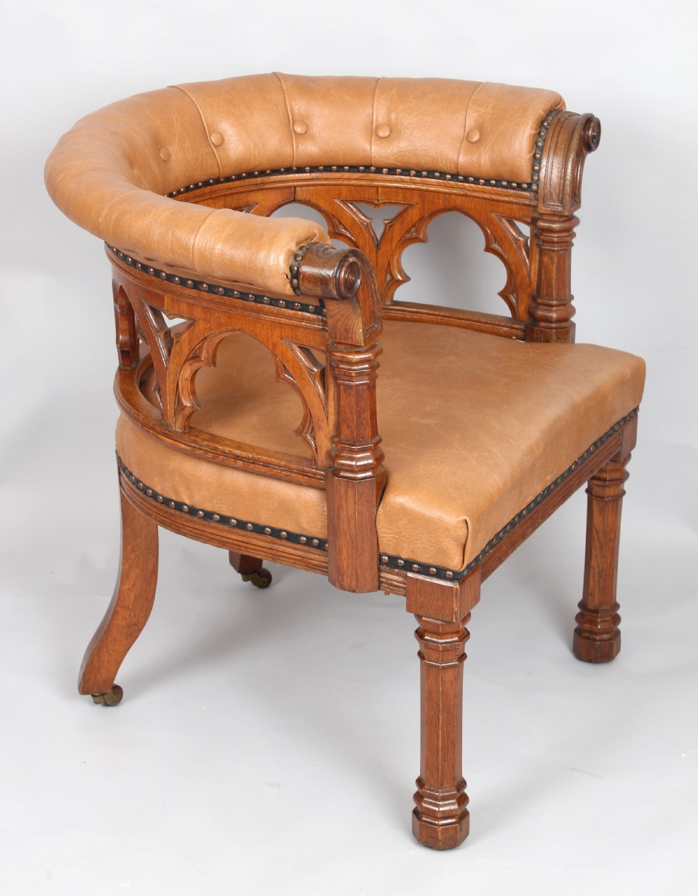 Victorian golden-oak tub armchair in the Gothic Revival manner View III