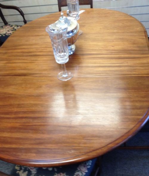 fig 1. Antique mahogany extending pull out dining table on turned quadrapartite base with single leaf circa 1860