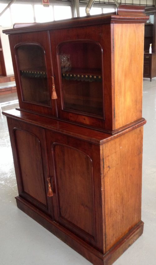 fig 1. Antique mahogany bookcase over cupboard in original condition of small proportions