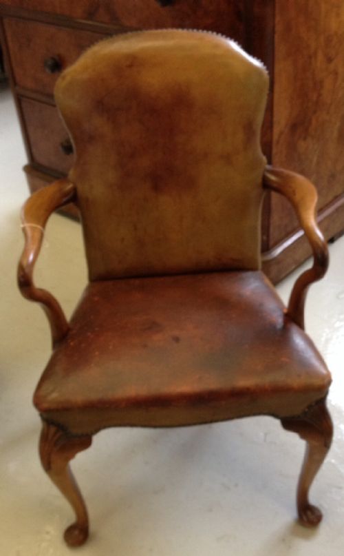 fig 1. Leather desk chair with crook arms and carved cabriole legs circa 1920