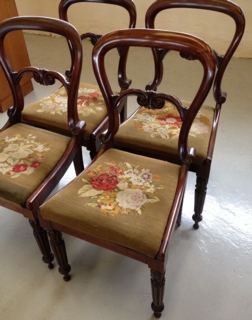 fig 1. Four Victorian rosewood balloon back chairs with original needlepoint seats circa 1860