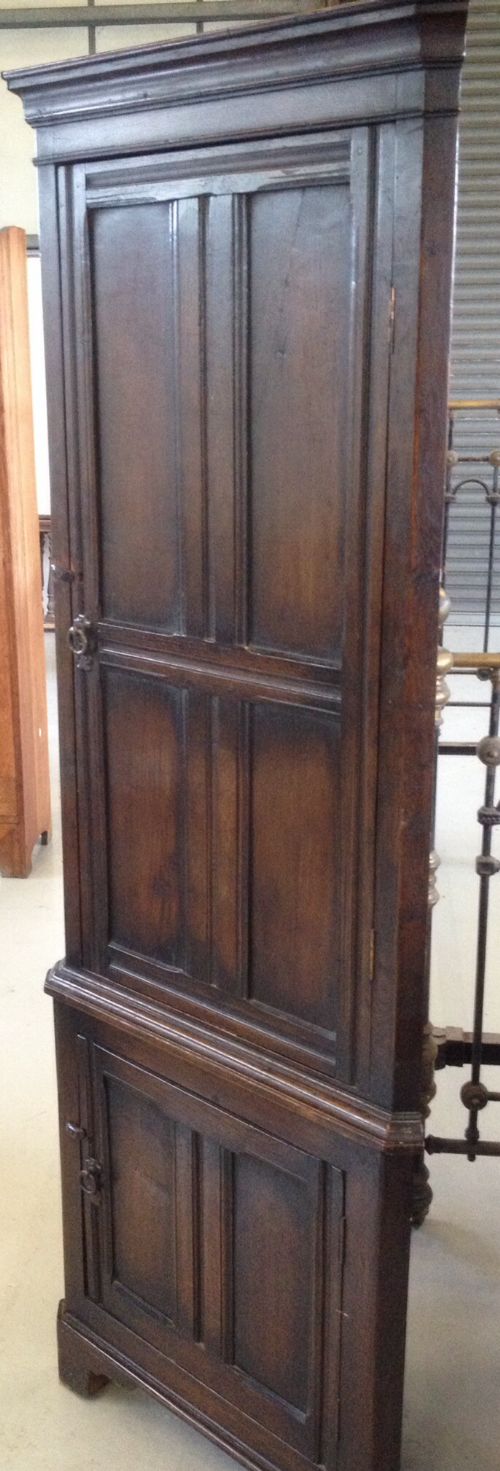 fig 1. Nineteenth century floor standing oak corner cabinet - panelled doors