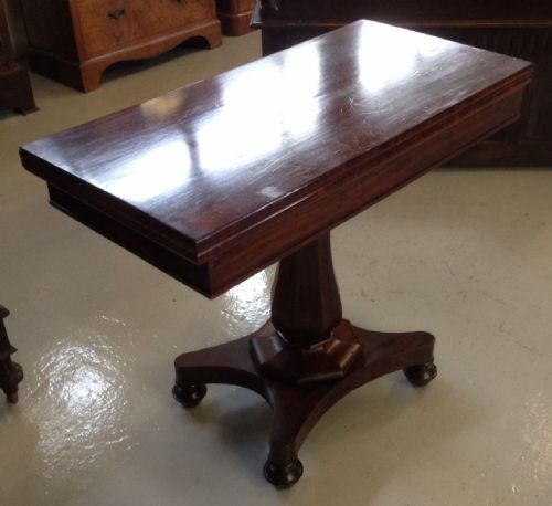 Victorian Mahogany Fold Over Card Table on Faceted Stem and Quadrapartite Base Circa 1850
